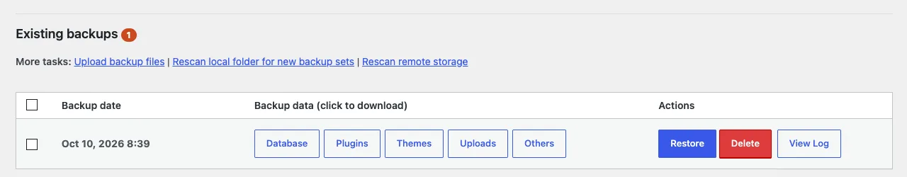 The UpdraftPlus Existing backups screen showing a backup set from October 10 with Restore, Delete and View Log buttons